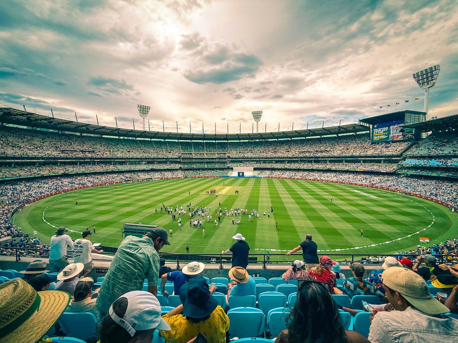 Packed crowd watching a cricket match at the Melbourne Cricket Ground