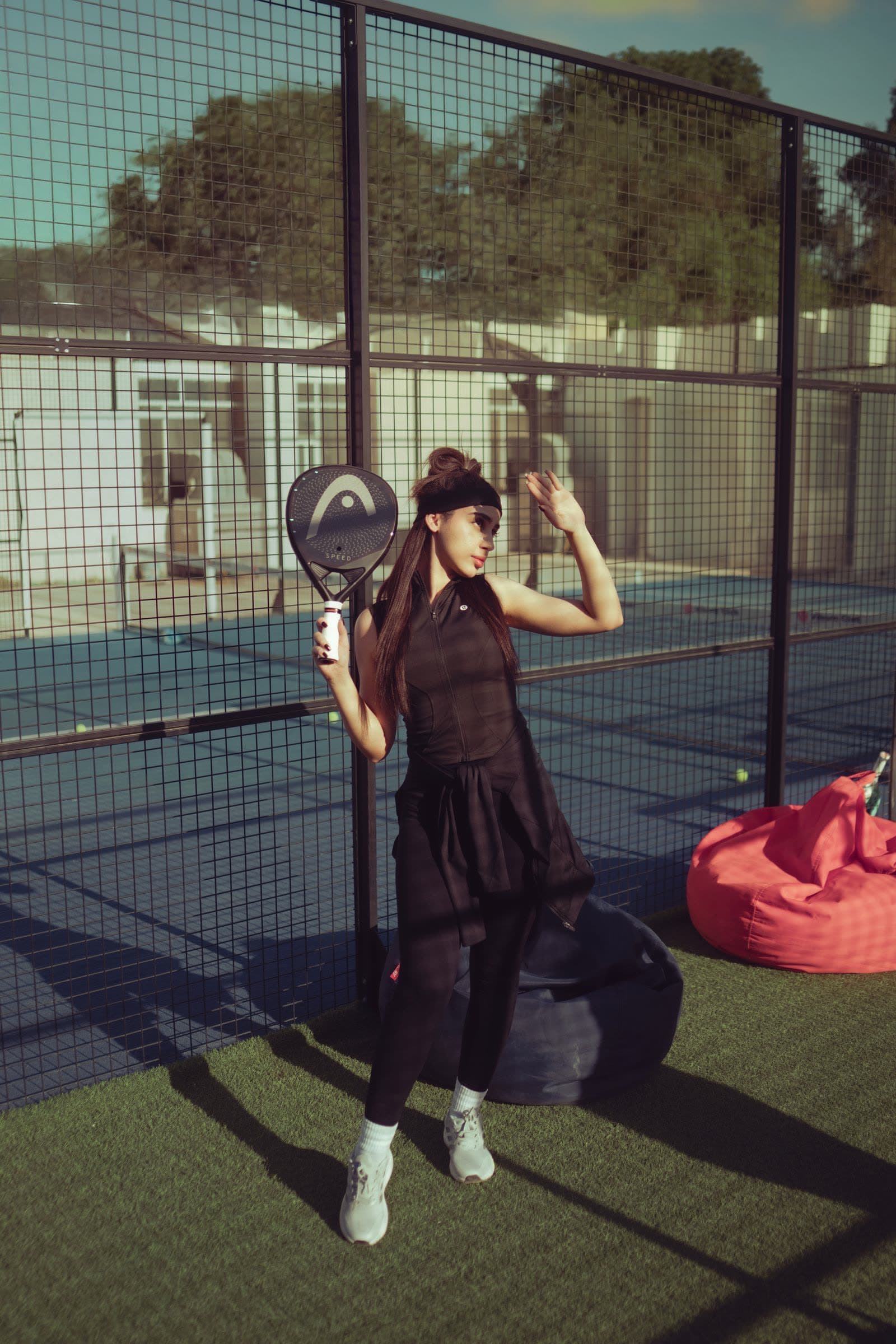 Padel player holding a racket on an outdoor court